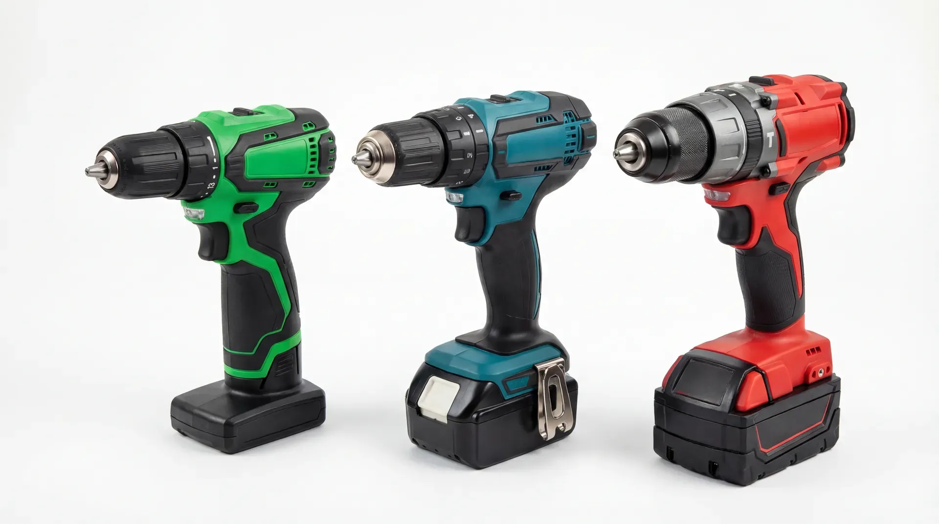 Three cordless combi drills arranged side by side: a compact green budget model on the left, a mid-sized teal mid-range model in the centre, and a larger red professional model on the right
